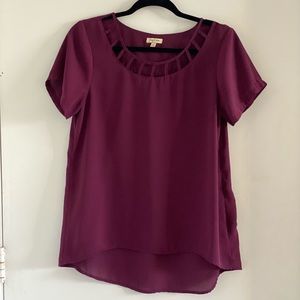 Soft eggplant colore blouse with cut out detail in the front
